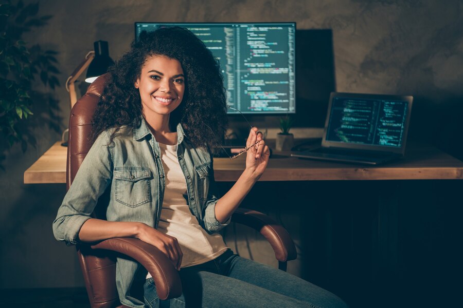 portrait-positive-skilled-girl-sit-chair-posing-office_274222-22784.jpg